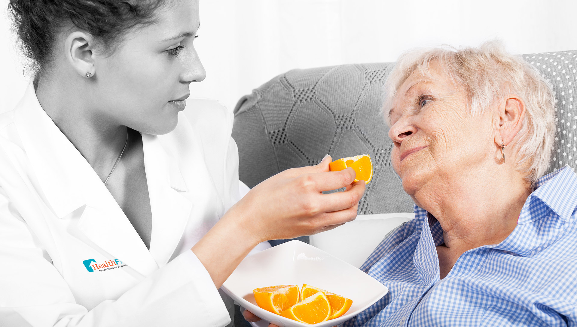 nutritionist-nurse-feeding-elderly-woman